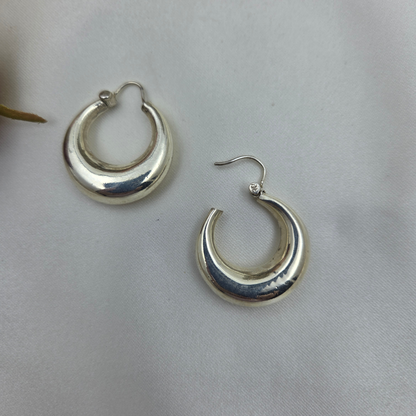 polished silver crescent-shaped hoop earrings 