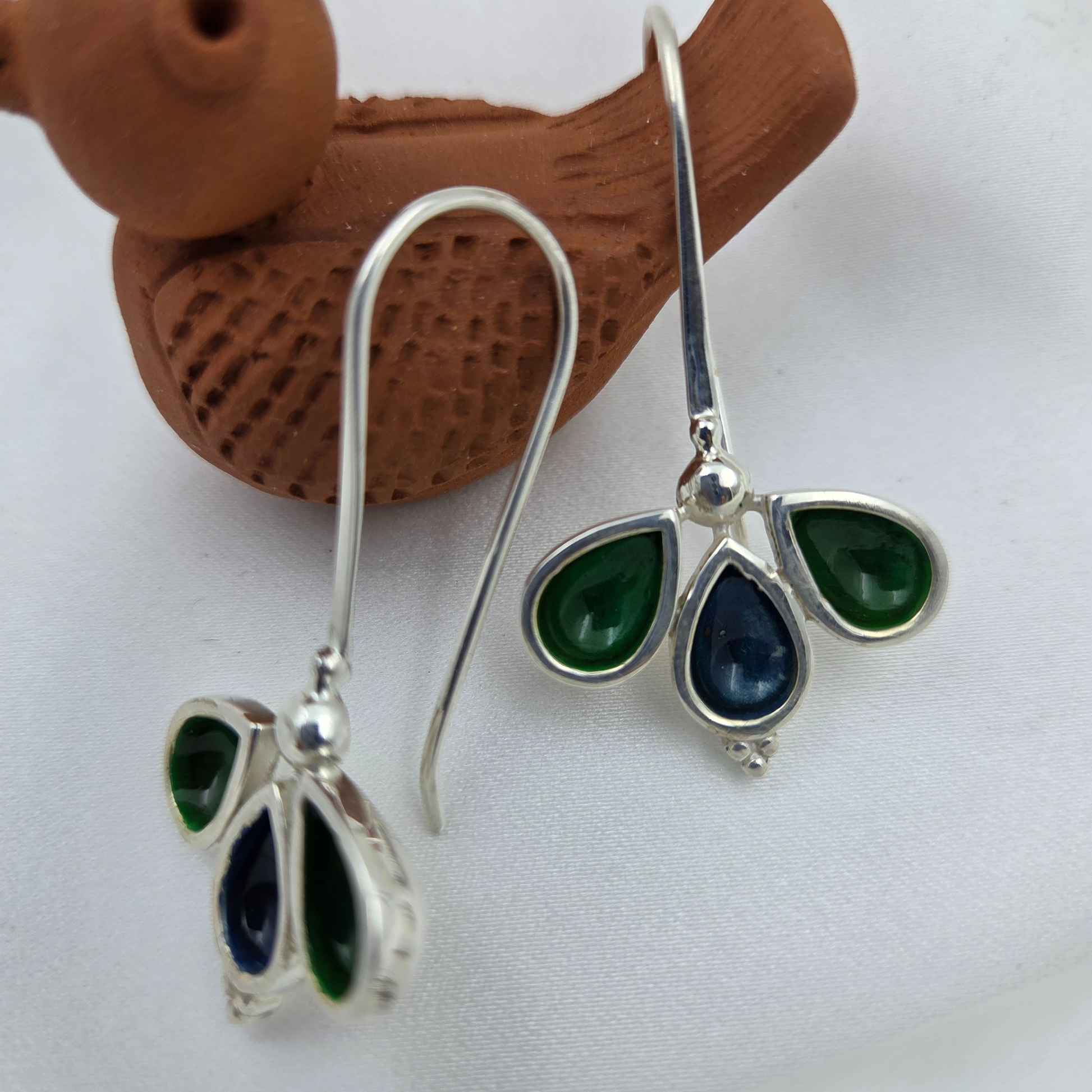 Three leaves with peacock colours